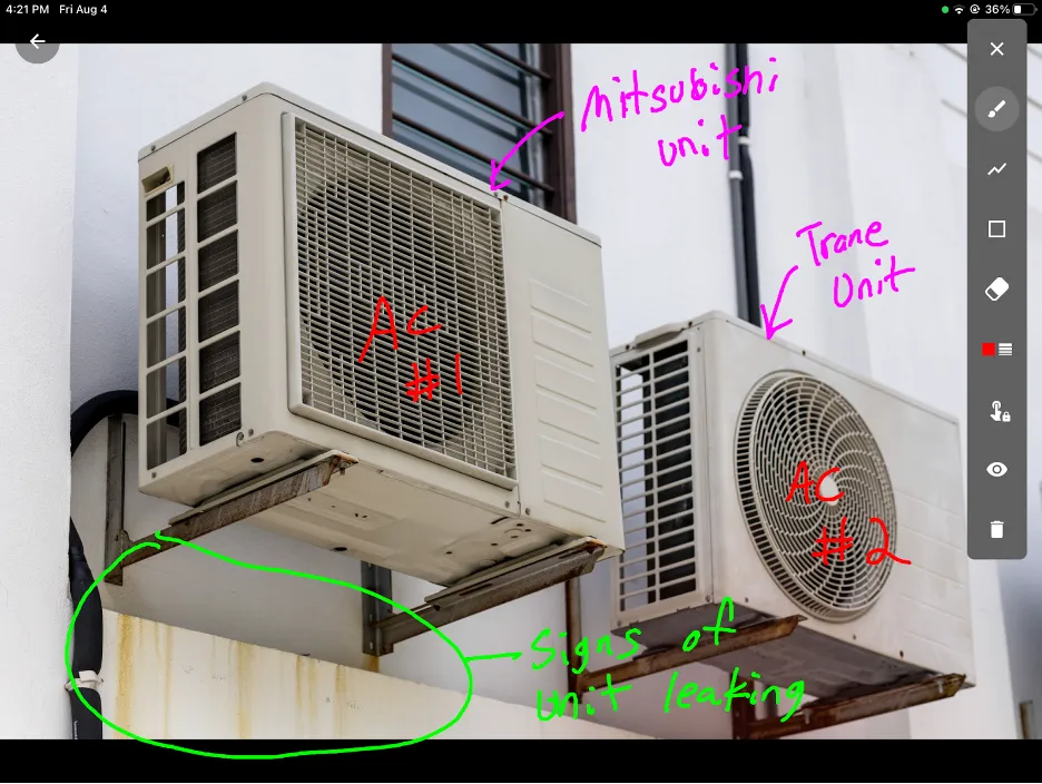 Two air conditioner units marked up in AkitaBox Capture app with details written on the screen.